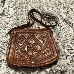 Beautiful vintage hand tooled leather shoulder bag.